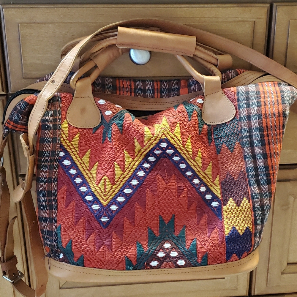 Artisan bag with leather straps.